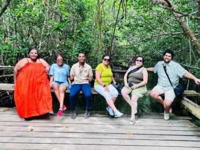 Small group seated on the mangrove boardwalk at Jozani Forest, Zanzibar